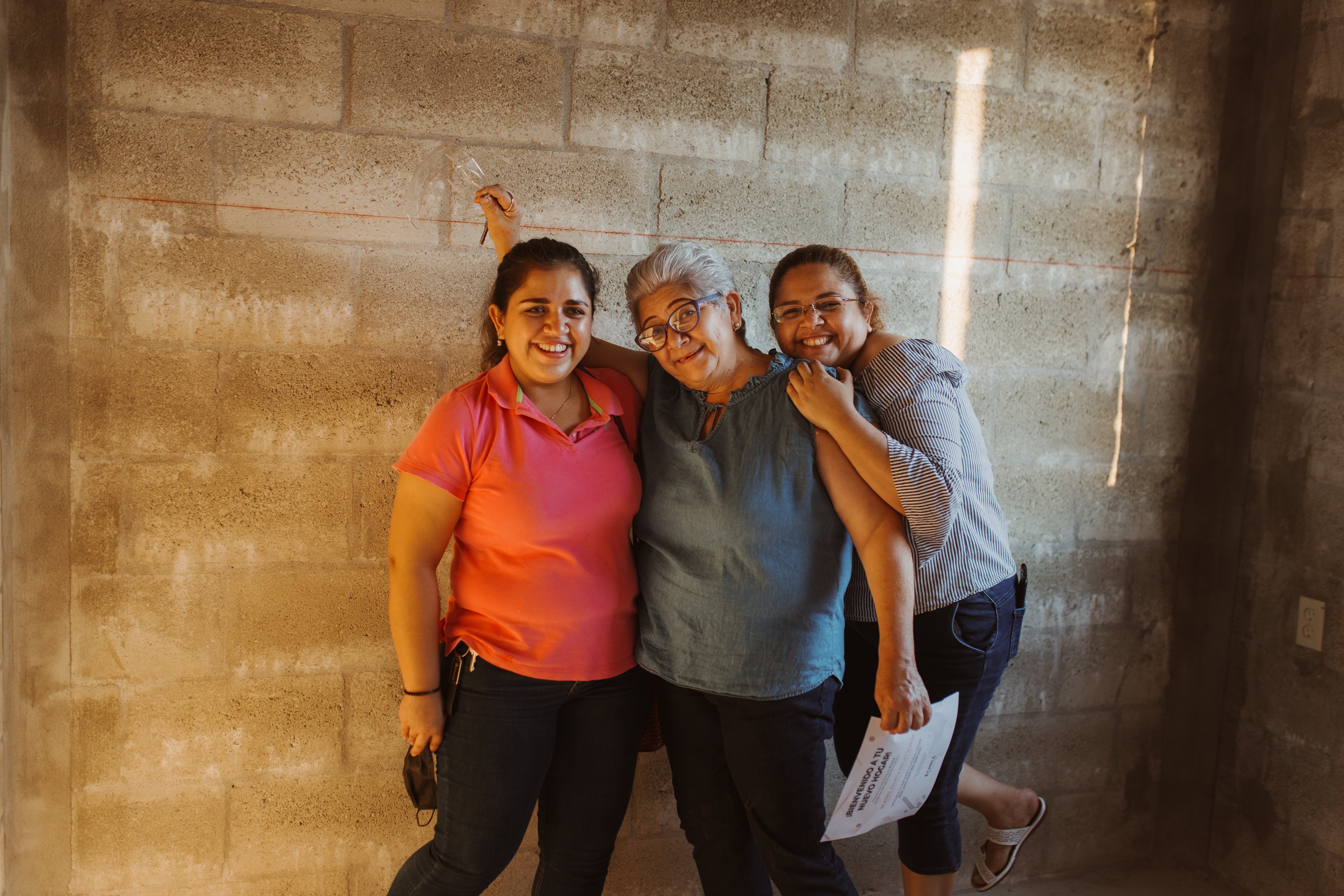 Beatriz with daughters in new home